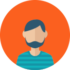 A man with a beard and mustache is in front of an orange circle.